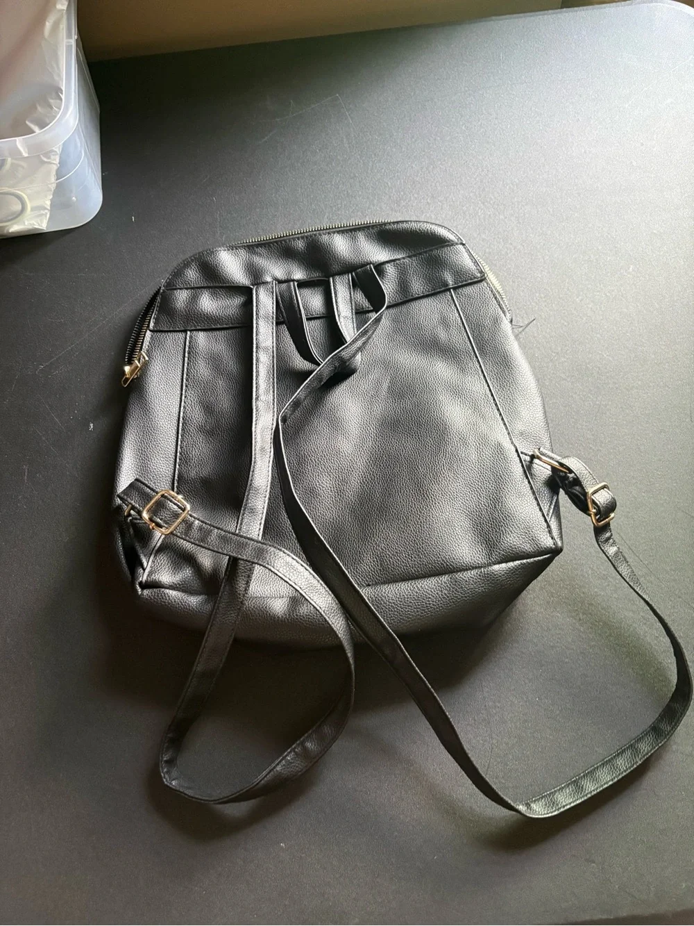 Quilted Black Crossbody Backpack with Gold Accent